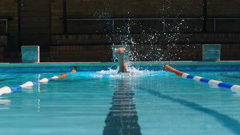 male swimmer swimming inside pool 4k