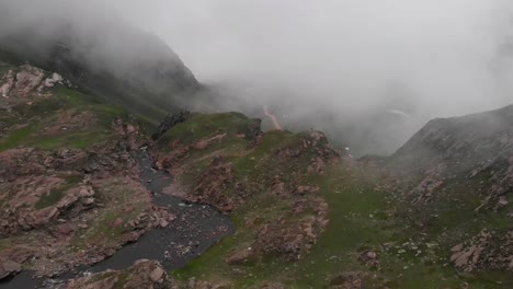 Drone-takes-an-aerial-shot-of-the-fog-covered-Patlian-Lake-located-in-Neelum-valley-Azad-Kashmir-Pakistan