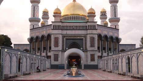 panning up at the elegant golden deisng of jame' asr hassanil bolkiah mosque in bandar seri bagawan in brunei darussalam