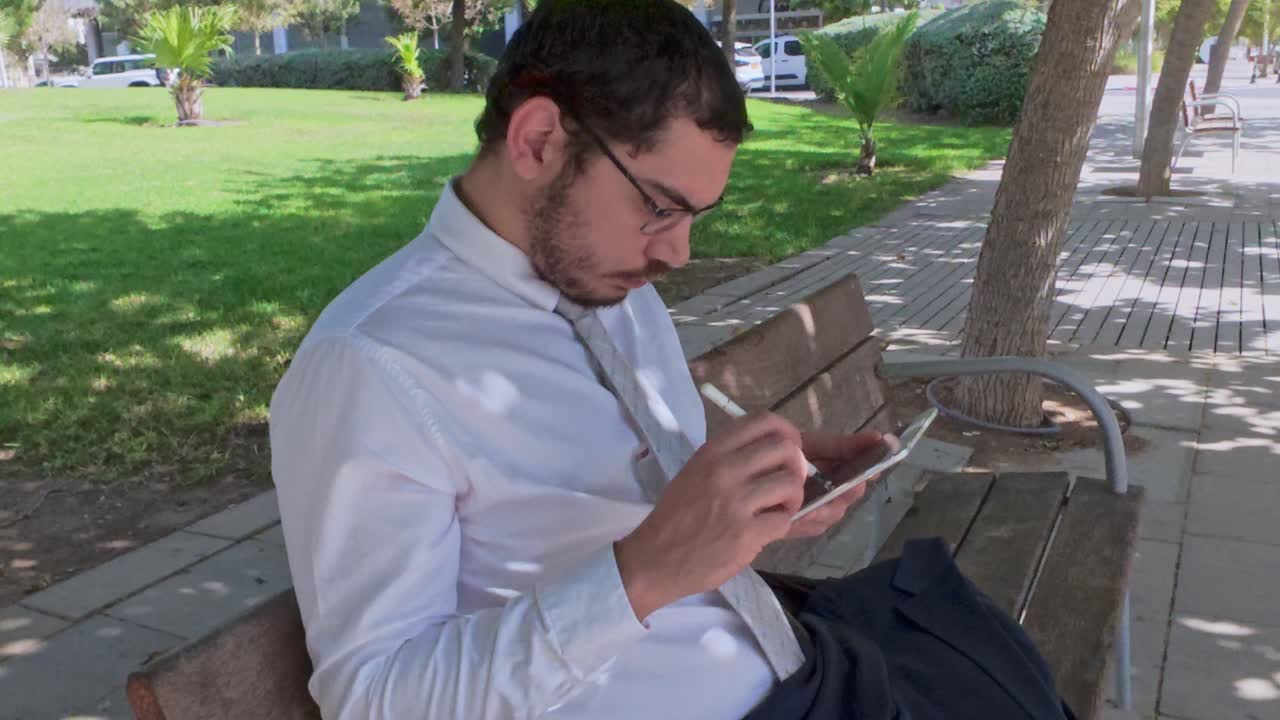 Focused Professional Signing a Document on a Digital Tablet