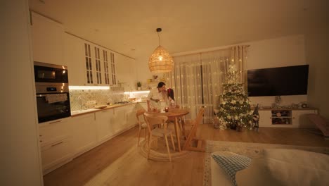 mother and daughter preparing for christmas celebration