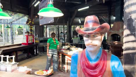 bustling market activity with a cowboy statue