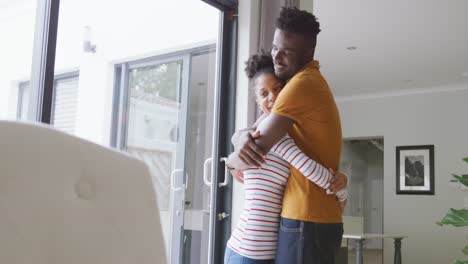 Video-of-happy-african-american-couple-embracing-at-home