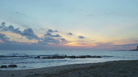 Dusk-at-an-empty-beach-near-Marbella,-Spain