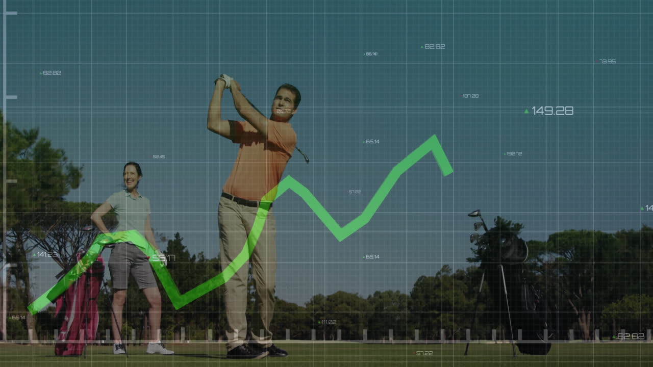 male golfer swinging club as woman golfer watching sports analytics line graph on golf course