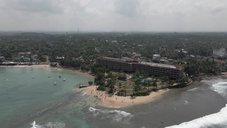 Beautiful-low-rise-Hikka-Tranz-resort-on-beach-at-Hikkaduwa,-Sri-Lanka