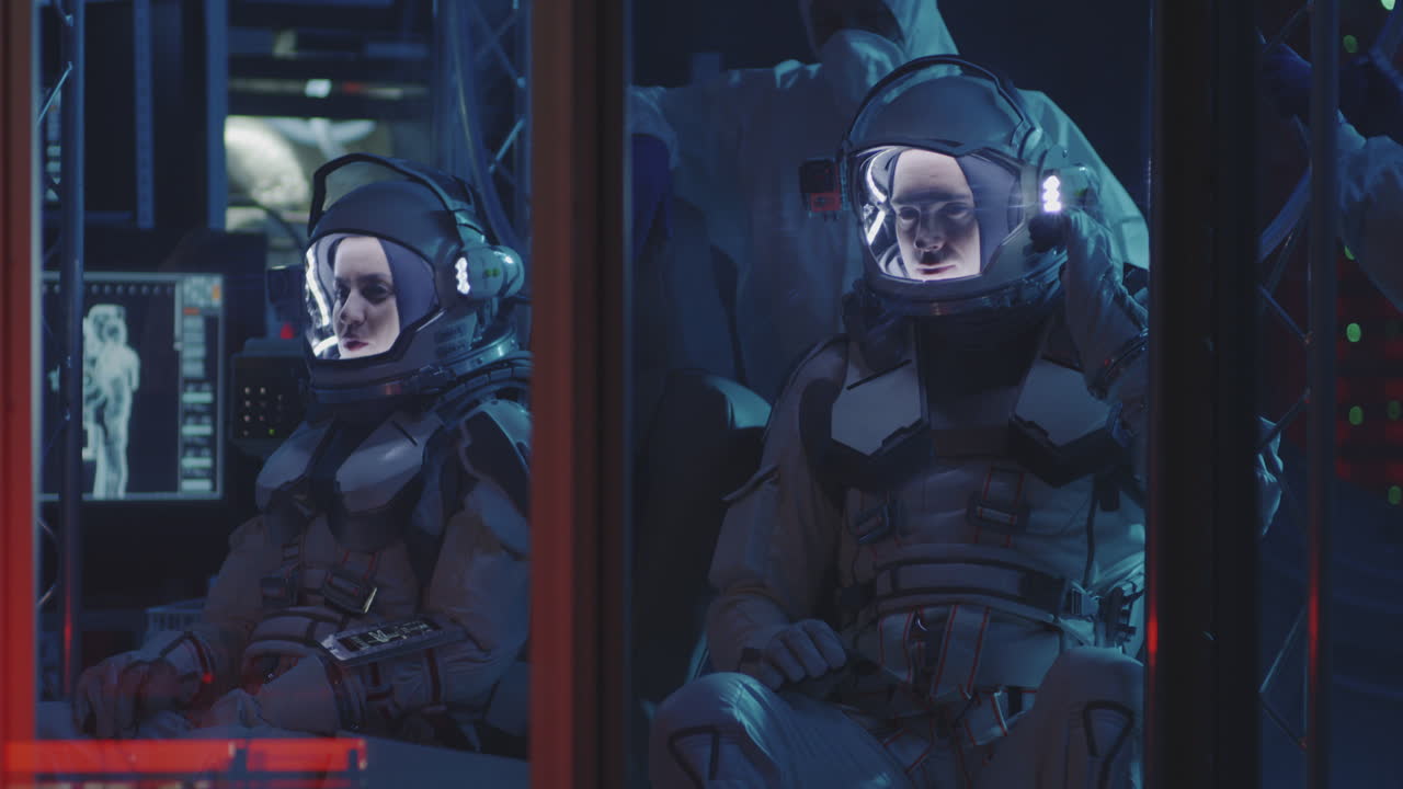 Astronauts in a Space Station Monitoring Center