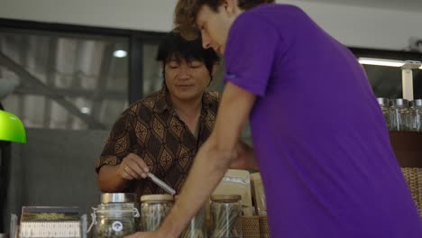 a customer and a seller interacting at a cannabis dispensary
