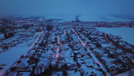 houses covered with snow on a winter night