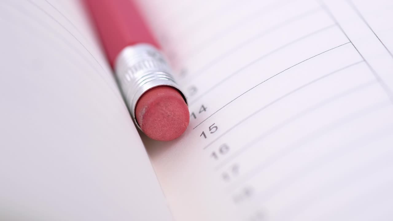 Pencil and Eraser on a Notebook Page