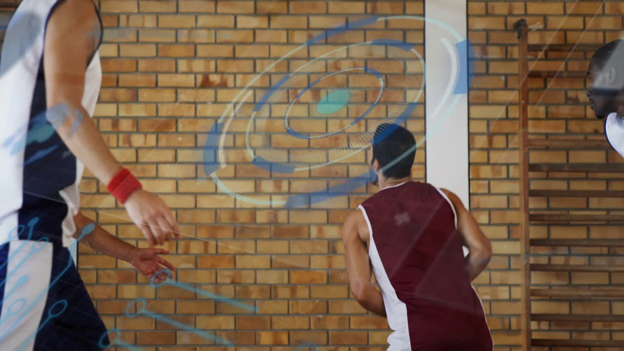 Maroon player controlling blue basketball shielding and pivoting to basket as blue overlays guiding