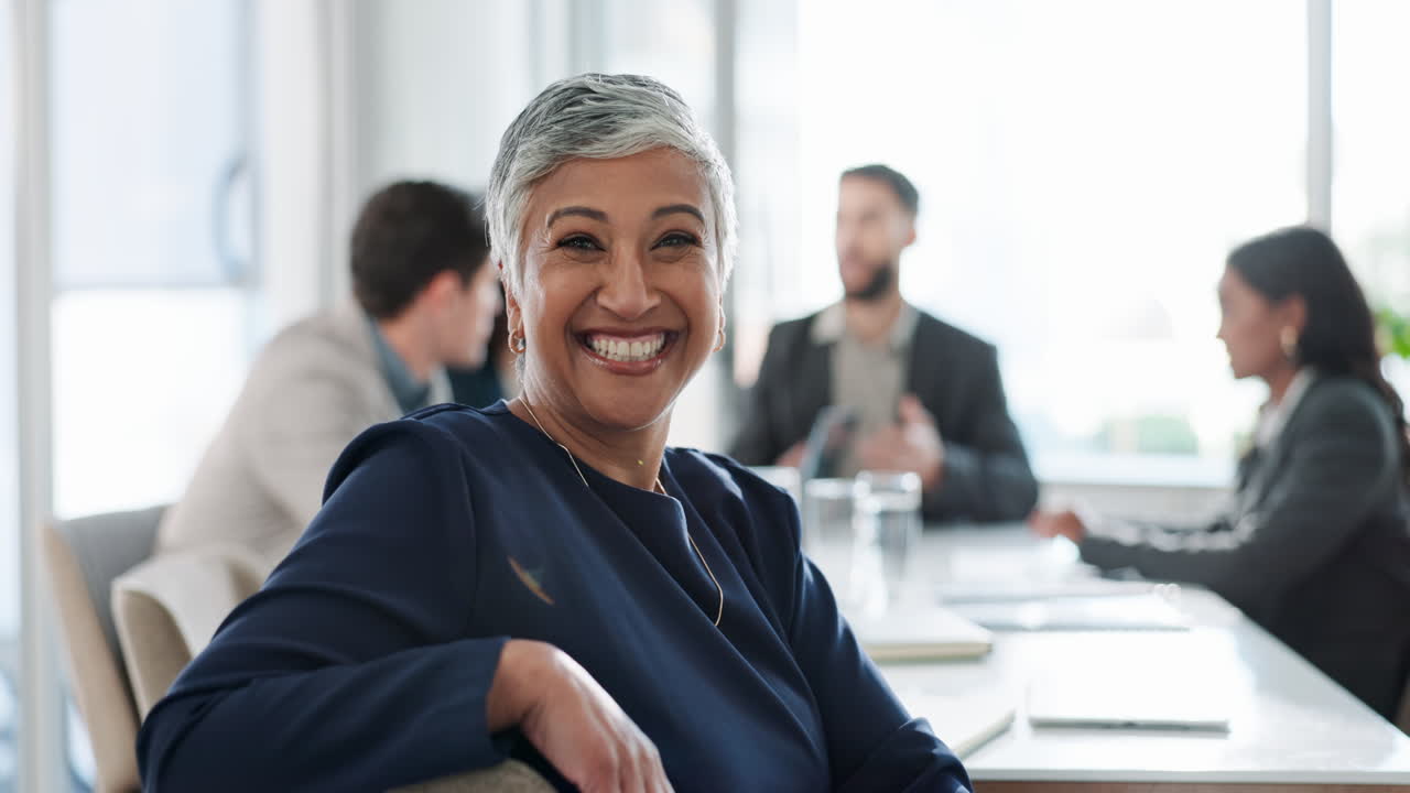 Business people smiling at a meeting