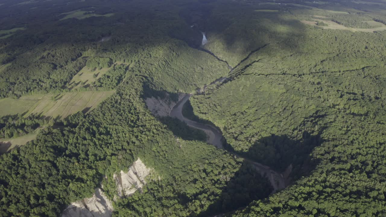 Drone footage of Zoar Valley, New York. This is one clip of many in this series - each of which shows a different angle of the valley and slightly different contents (rivers - mountains) in the frame.