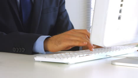 Businessman-typing-on-his-computer