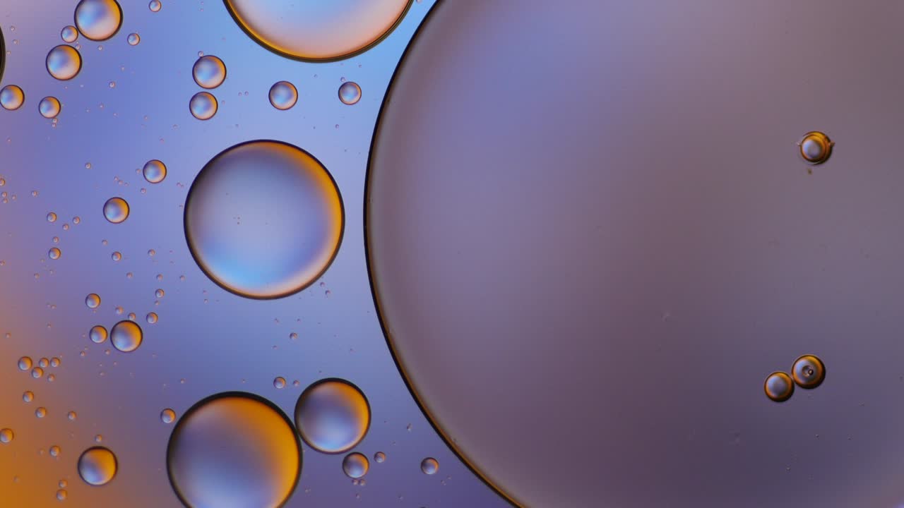 Colorful artistic of oil drop floating on the water.