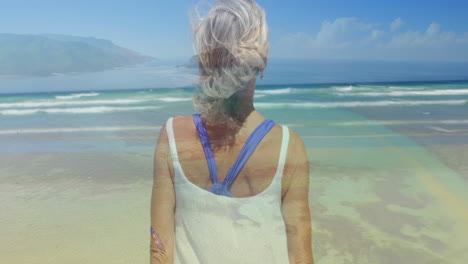 mujer mirando fijamente las olas 4k