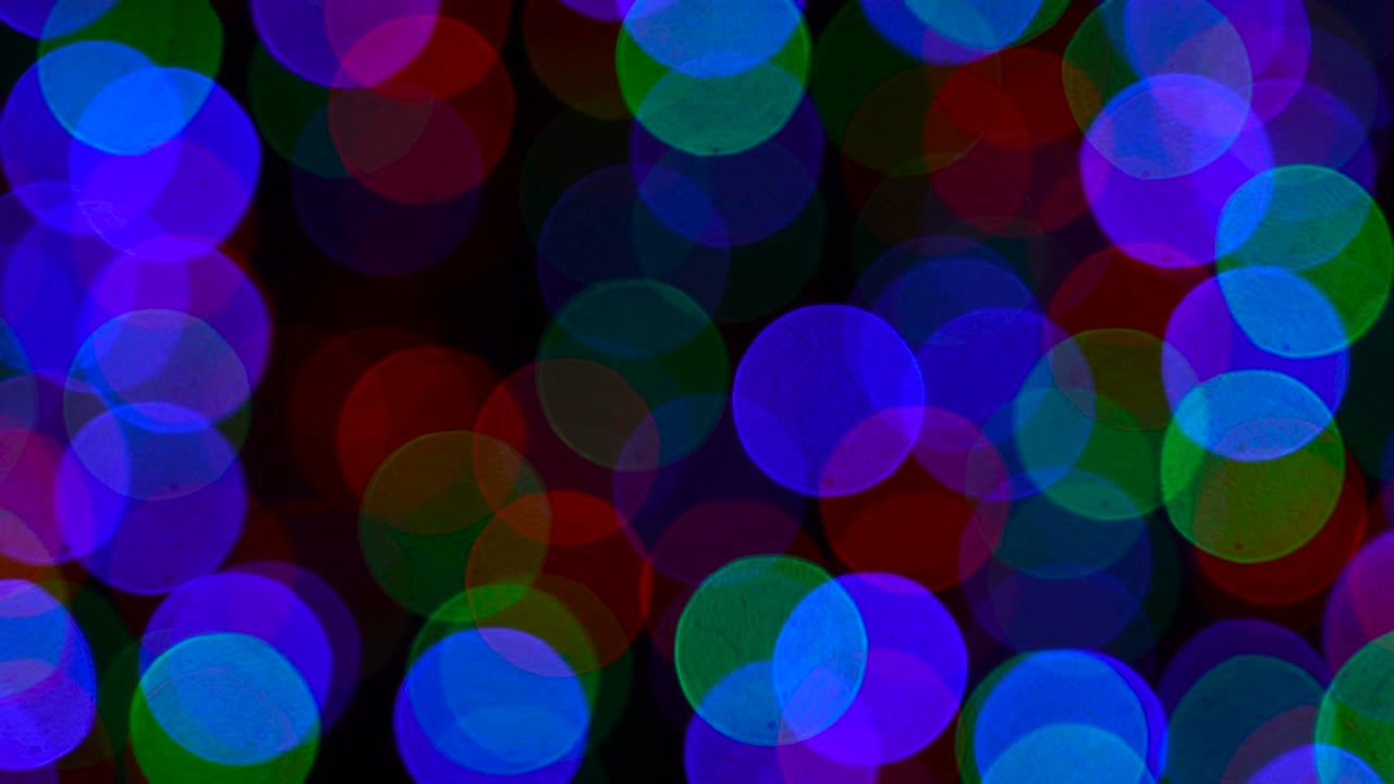 el fondo borroso de las luces de bokeh de navidad. luces de varios colores, guirnaldas. concepto de vacaciones de invierno.