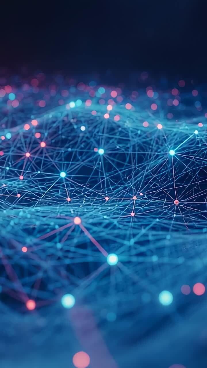 Vertical video: Panning camera revealing mesh rolling and pulsing in navy, exposing cyan pink nodes