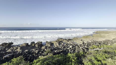 a captivating view of waves crashing against the rocky shoreline of oahu, hawaii