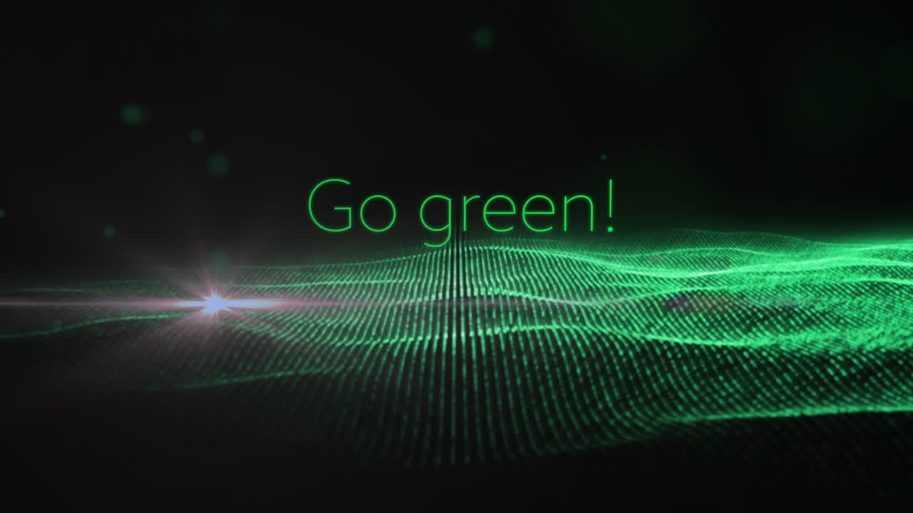 Composition of go green over glitter on black background