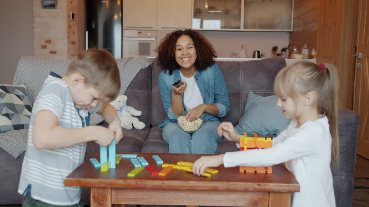 Kids Playing and Watching TV