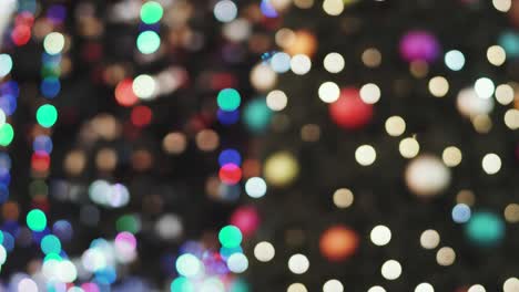 christmas lights bokeh background adorn the floor of a large modern shopping center. blurred bright christmas lighting in the mall. glitter