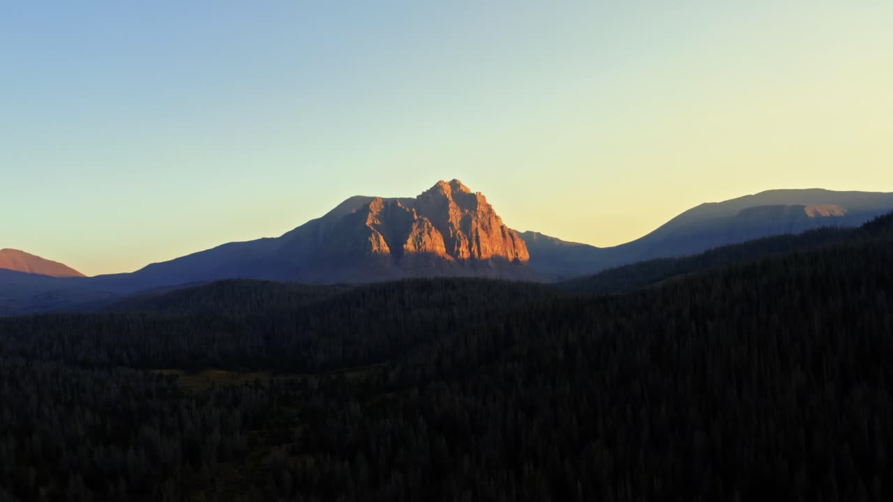 Stunning aerial drone landscape nature dolly in shot of the beautiful Red Castle Lake mountain up in the high Uinta's between Utah and Wyoming on a backpacking trip during a summer sunset