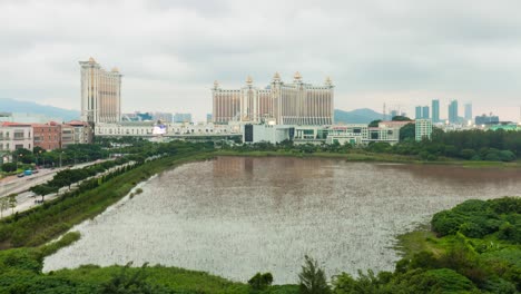 china macau day light famous hotel block pond panorama 4k time lapse