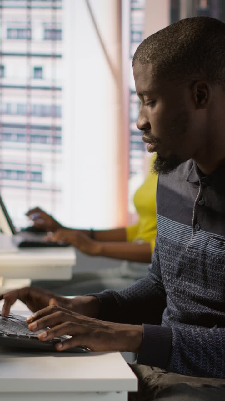 Vertical video Programmer doing software debugging, asking for help from smiling team leader