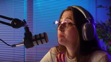 young woman engaged in podcasting or streaming