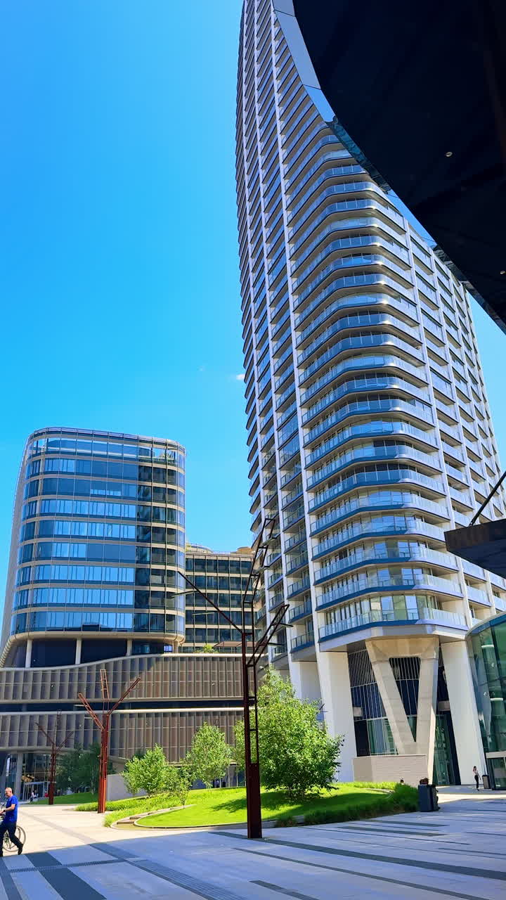 High-rise building of unusual style and design. Low angle view. Architecture of Bratislava, Slovakia. Vertical video.