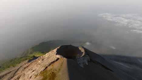 Aerial:-Static-shot-of-active-Fuego-volcano-crater-in-Guatemala-during-sunrise