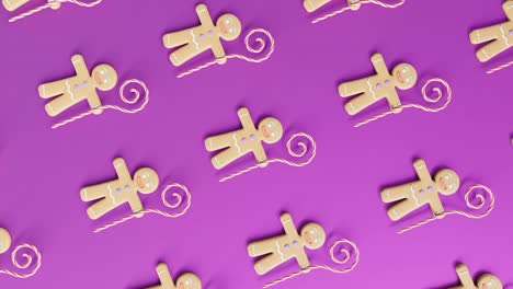 Gingerbread-Men-and-Candy-Canes-on-a-pink-background-vertical