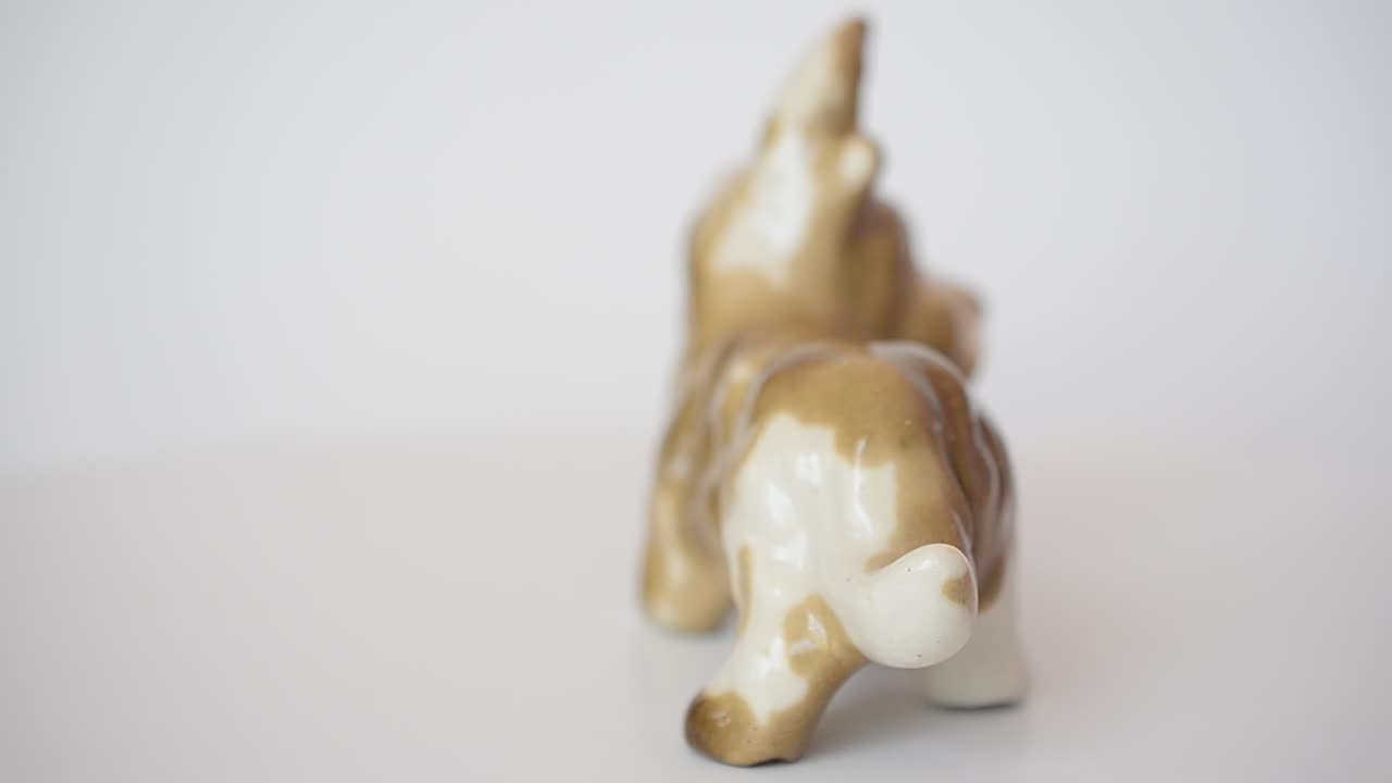 Shooting of a figurine of a terrier. Shooting of a figurine