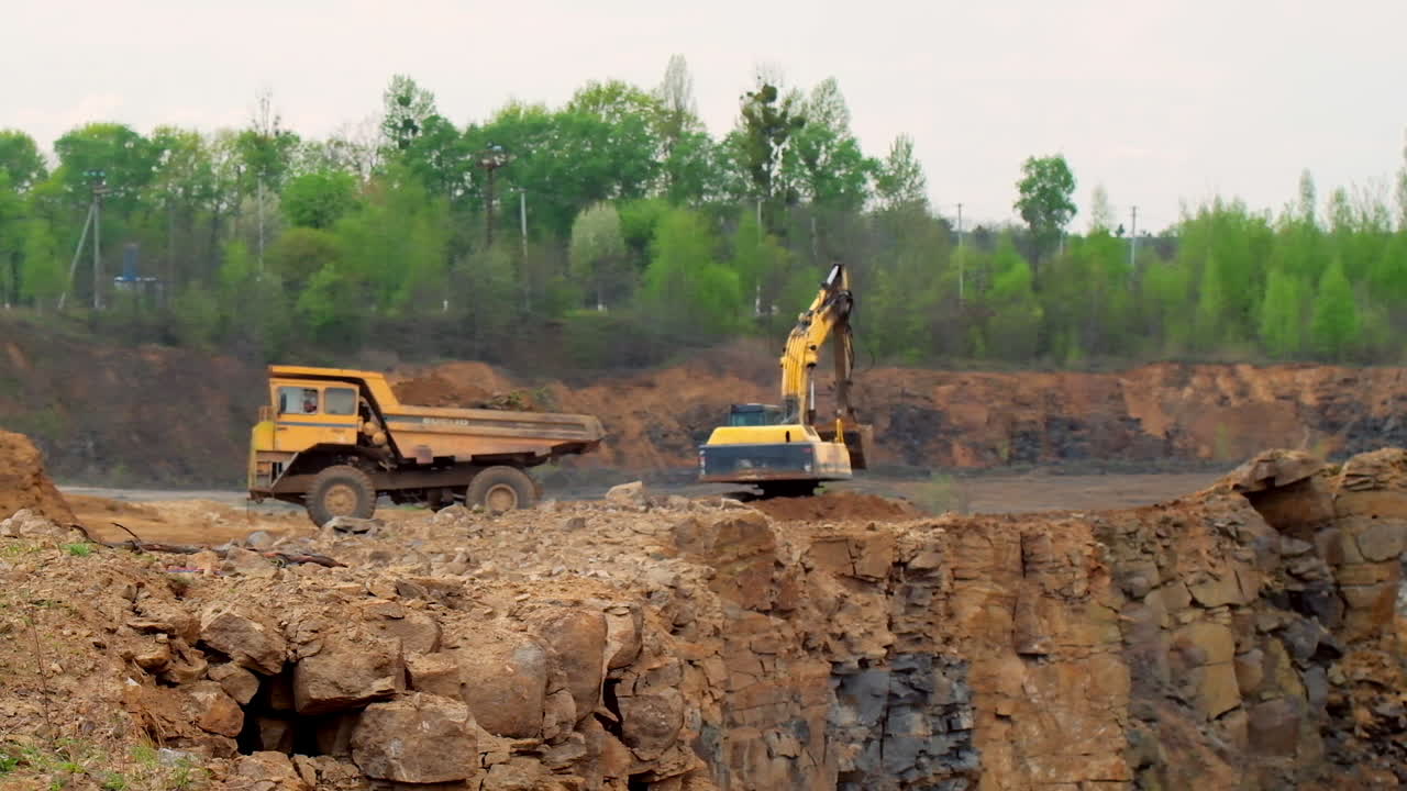 Extraction industry mining transport. Heavy excavator working in quarry