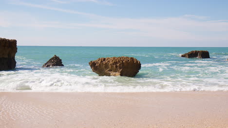 Sea-Stacks-By-The-Sea-Waves-In-Algarve,-Portugal---wide