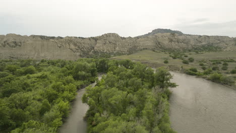 alazani river landscape below rocky cliffs in vashlovani, georgia