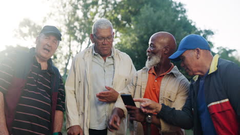 group of senior men discussing in a park