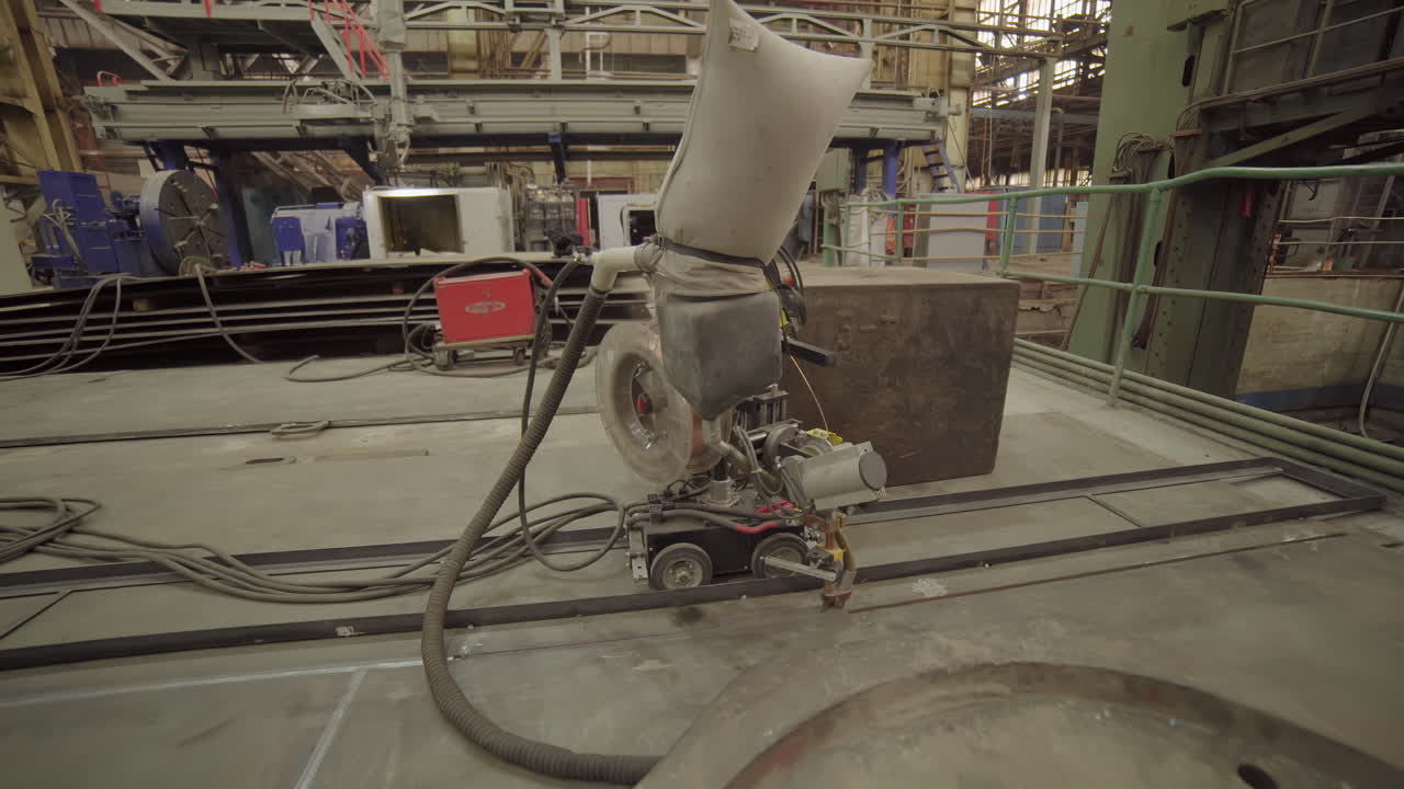 Industrial Welding Robot in a Factory