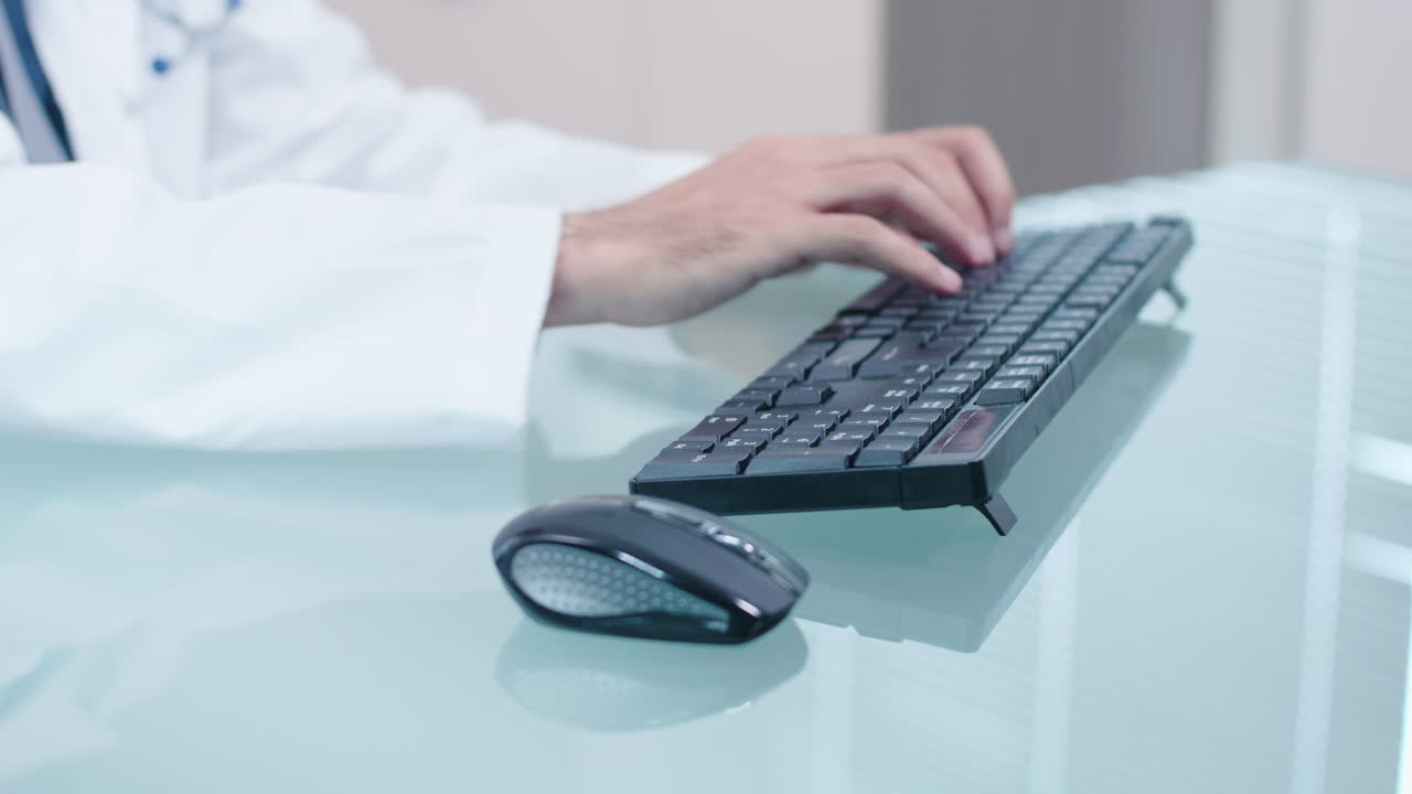 Doctor typing on a keyboard