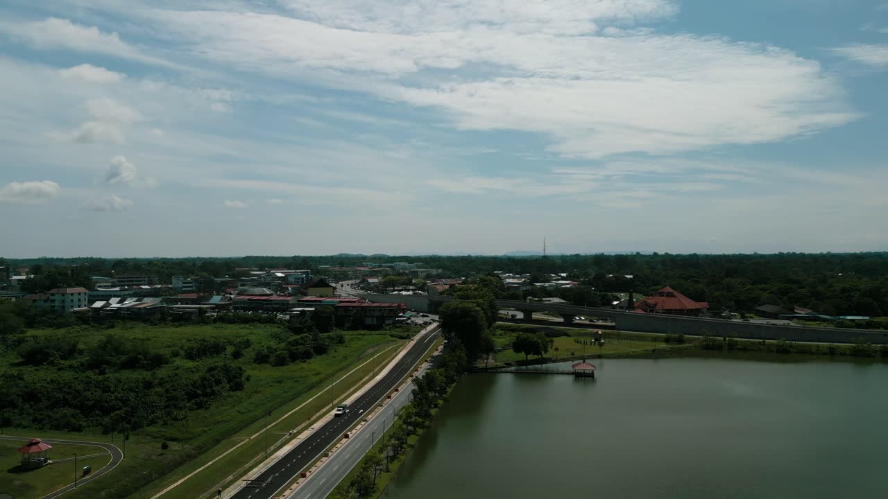 Aerial Drone View, Serian District Town ,Summer With Beautiful Green Trees,New Building And Water Park Lake, Water From The Mountain Sarawak,Borneo.