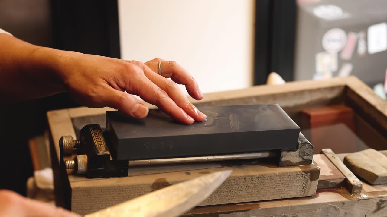 Sequential knife sharpening on a stone block