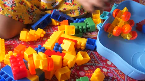 baby playing with colorful building blocks