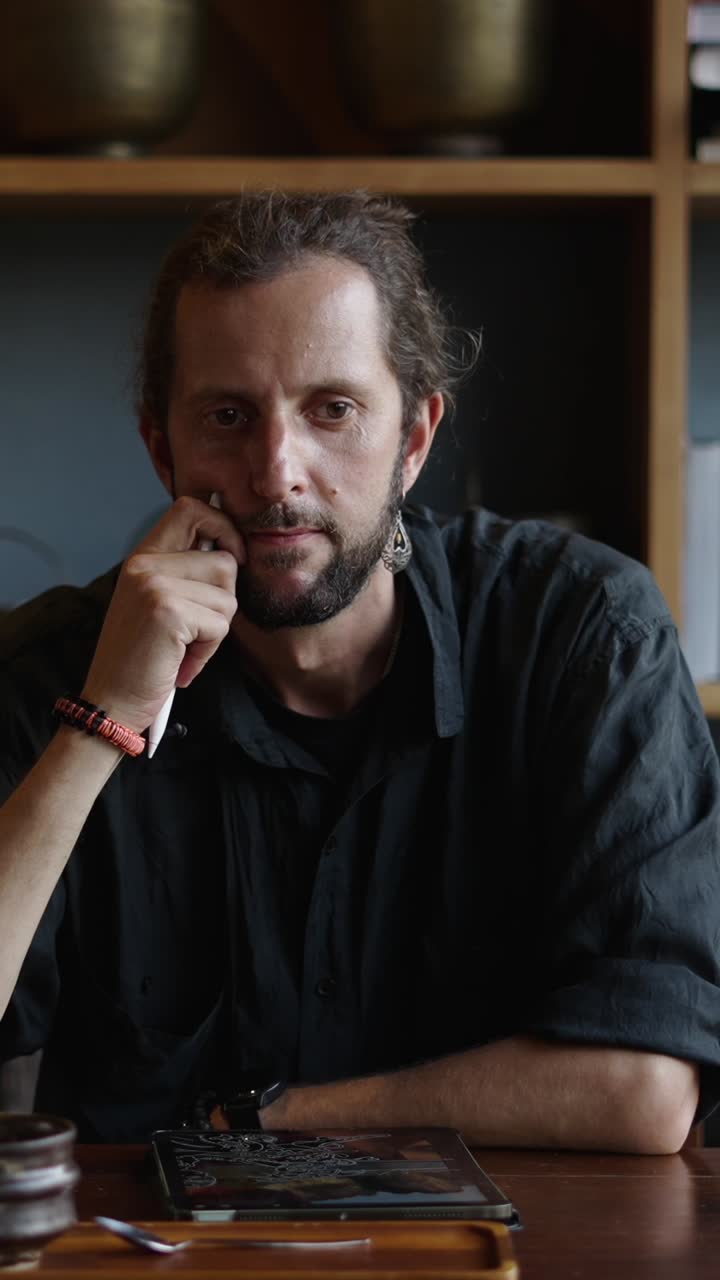 Man using a tablet with a pen