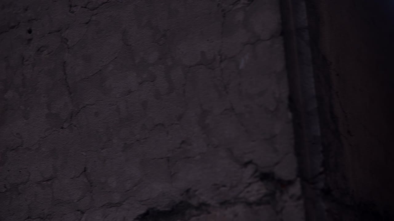 Ancient inscription on a stone and Italian city buildings