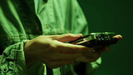 person holding a vintage cassette tape player