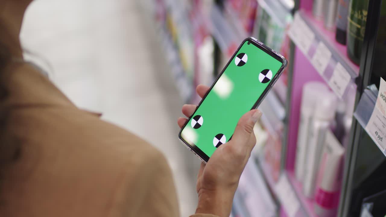 Woman With Smartphone In Beauty Shop