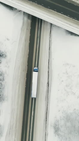 snowy highway intersection with truck