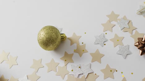 decorations and stars on white background at new year's eve