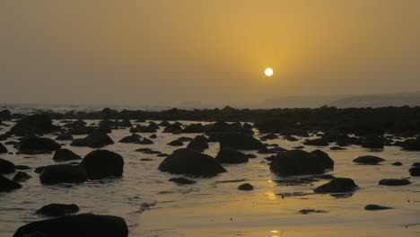 coast with rocks at sunset